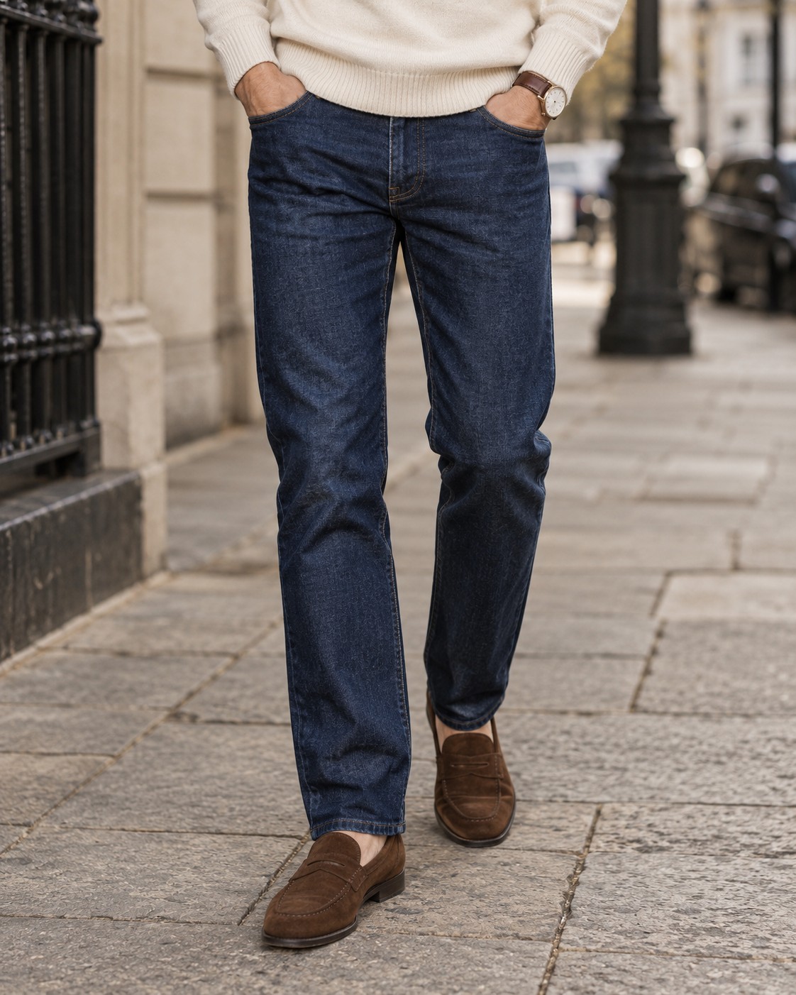 Dark indigo straight jeans with a cream knit and brown suede loafers.