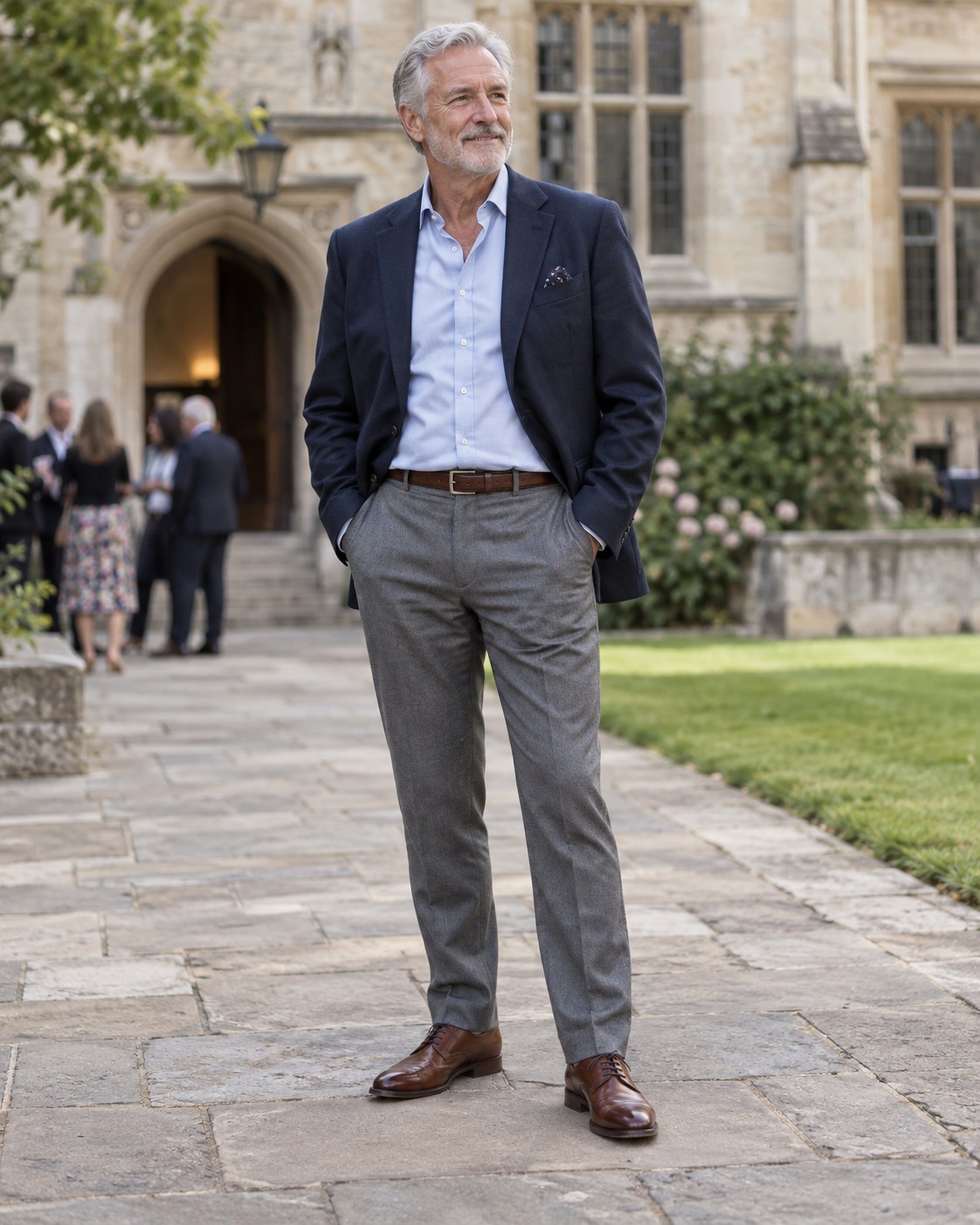 A blazer, pale shirt and grey trousers in a university courtyard.
