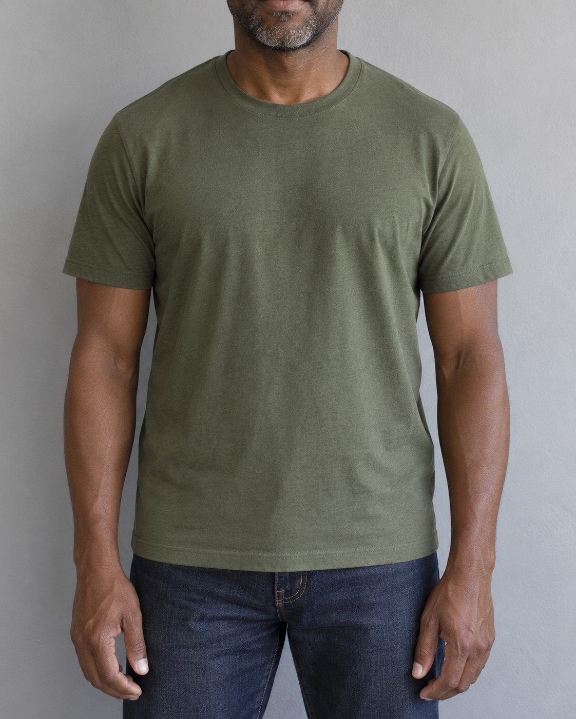 A green T-shirt with shoulder seams aligned and a relaxed torso fit.